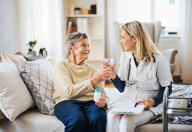 Carer talking with an older woman Carer talking with an older woman